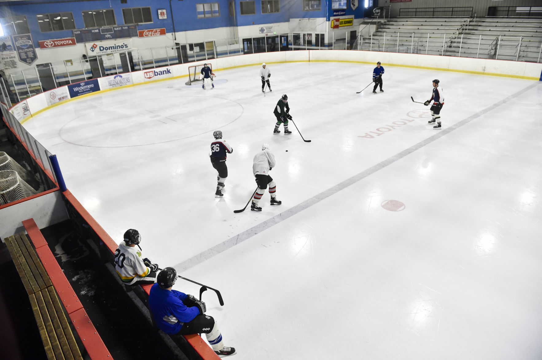 A group of adults play a pick-up hockey game at the Helena Ice Arena
